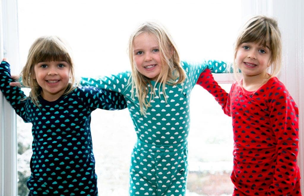 Children in pyjamas, excited about heading to Santa's Lapland for Christmas Day